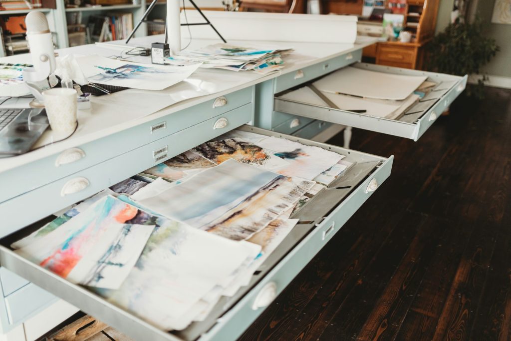 white printer papers on white wooden desk
